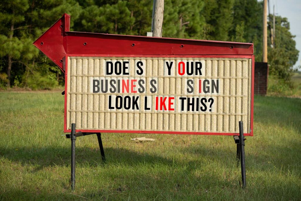 Image of a broken old sign in lafayette Louisiana